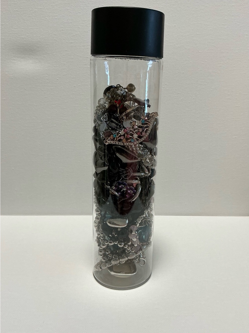 Clear Jewelry Tube Filled with 25 Mixed Costume Jewelry Multicolor Items.